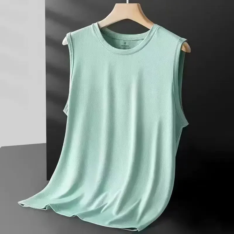 Light green sleeveless shirt on a hanger against a dark background